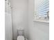 Bathroom featuring a toilet, shower and natural light at 8255 Bryce Canyon Ave, Windermere, FL 34786