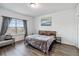 Cozy bedroom featuring natural light, wood bed frame, and chair at 8255 Bryce Canyon Ave, Windermere, FL 34786