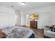 Bright bedroom showcasing a mounted TV, sitting chair, and closet at 8255 Bryce Canyon Ave, Windermere, FL 34786