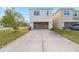 Two-story home boasting a two-car garage and well-manicured lawn at 8255 Bryce Canyon Ave, Windermere, FL 34786