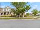 Lovely two-story home with a covered front porch and lush landscaping enhancing curb appeal at 8255 Bryce Canyon Ave, Windermere, FL 34786