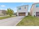 Two-story home features a two-car garage, neutral paint, manicured lawn and is located on a tree-lined street at 8255 Bryce Canyon Ave, Windermere, FL 34786