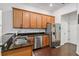 Kitchen featuring stainless steel appliances, granite countertops, and wood cabinets at 8255 Bryce Canyon Ave, Windermere, FL 34786