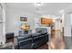 Open living room featuring wood floors and a view into the kitchen and dining area at 8255 Bryce Canyon Ave, Windermere, FL 34786