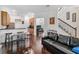 Open-concept living area with dark hardwood floors and a view to the kitchen at 8255 Bryce Canyon Ave, Windermere, FL 34786