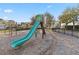 Community playground with slide and swings offers safe recreation with a secure fenced perimeter at 8255 Bryce Canyon Ave, Windermere, FL 34786
