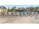 Community pool offers ample seating and sun umbrellas surrounded by well-maintained grounds in a resort-style setting at 8255 Bryce Canyon Ave, Windermere, FL 34786