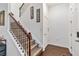 Beautiful stairway with wood railing and carpet on the steps to the second level at 8255 Bryce Canyon Ave, Windermere, FL 34786