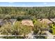Aerial view of a home with manicured landscaping and mature trees at 9122 Stromboli Ct, Kissimmee, FL 34747