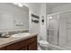 Clean bathroom featuring a glass-enclosed shower and decorative beach accents at 9122 Stromboli Ct, Kissimmee, FL 34747