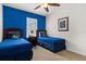 bedroom featuring two twin beds with blue Toy Story themed bedding at 9122 Stromboli Ct, Kissimmee, FL 34747
