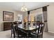 Elegant dining room featuring a glass-top table, seating for eight, and stylish decor at 9122 Stromboli Ct, Kissimmee, FL 34747