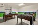 Large game room with multiple activities including pool, foosball, and convenient laundry facilities at 9122 Stromboli Ct, Kissimmee, FL 34747