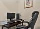 Functional home office space with modern computer setup and comfortable executive chair at 9122 Stromboli Ct, Kissimmee, FL 34747