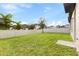 Large, well-maintained backyard with lush lawn and a privacy fence, perfect for outdoor activities at 9947 Summerlake Groves St, Winter Garden, FL 34787
