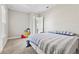 Comfortable bedroom with carpet flooring and a window providing ample light and serene backyard view at 9947 Summerlake Groves St, Winter Garden, FL 34787