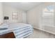 Comfortable bedroom with carpet flooring and a window providing ample light and serene backyard view at 9947 Summerlake Groves St, Winter Garden, FL 34787