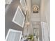 Stunning foyer featuring high ceilings, a modern chandelier, and eye-catching wall decor at 9947 Summerlake Groves St, Winter Garden, FL 34787
