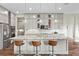 Kitchen island with granite countertops and stainless steel appliances, perfect for entertaining at 9947 Summerlake Groves St, Winter Garden, FL 34787