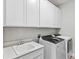 A laundry room featuring a sink, washer, and dryer at 9947 Summerlake Groves St, Winter Garden, FL 34787