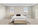 Cozy main bedroom with plush carpeting, dual windows, and stylish furnishings at 9947 Summerlake Groves St, Winter Garden, FL 34787