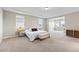 Cozy main bedroom with plush carpeting, dual windows, stylish furnishings, and adjacent sitting area at 9947 Summerlake Groves St, Winter Garden, FL 34787
