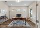 Spacious home office with hardwood floors, natural light, and a traditional executive desk at 9947 Summerlake Groves St, Winter Garden, FL 34787
