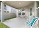 Spacious covered patio with neutral tones, providing an inviting outdoor living area at 9947 Summerlake Groves St, Winter Garden, FL 34787