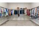 A large walk-in closet has an abundance of storage at 9947 Summerlake Groves St, Winter Garden, FL 34787