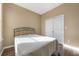 Comfortable bedroom features a double bed, closet, and wood floors at 11564 Mizzon Dr # 305, Windermere, FL 34786