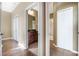 Hallway view of the bathroom with a dark-wood vanity and a shower/tub combo at 11564 Mizzon Dr # 305, Windermere, FL 34786