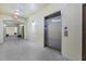 Hallway with elevator and carpet at 11564 Mizzon Dr # 305, Windermere, FL 34786