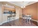 Kitchen area with breakfast bar and adjacent dining area showcasing a modern, functional living space at 11564 Mizzon Dr # 305, Windermere, FL 34786