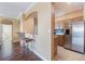 Kitchen area with stainless steel refrigerator and breakfast bar, creating an inviting transition to the living spaces at 11564 Mizzon Dr # 305, Windermere, FL 34786