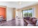 Open living room with balcony access and an adjacent dining area, creating a welcoming and bright space at 11564 Mizzon Dr # 305, Windermere, FL 34786