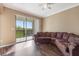 Bright living room featuring sliding glass doors that open to a balcony with treetop views at 11564 Mizzon Dr # 305, Windermere, FL 34786