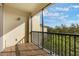 Charming balcony with a view of tropical trees, perfect for enjoying morning coffee or evening sunsets at 11564 Mizzon Dr # 305, Windermere, FL 34786