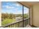 Enjoy peaceful views from the balcony overlooking lush greenery, perfect for relaxation and tranquility at 11564 Mizzon Dr # 305, Windermere, FL 34786