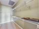 Walk-in closet with tiled floors and multiple levels of shelving for optimal storage and organization at 11564 Mizzon Dr # 305, Windermere, FL 34786