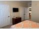 A well-lit bedroom with a queen-sized bed, a TV, and ample closet space at 1361 Tuscan Ter # 7105, Davenport, FL 33896