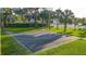 Community basketball court offering a great space for exercise and recreation, surrounded by trees at 1411 Ellis Fallon Loop, Oviedo, FL 32765