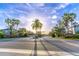 Community entrance with stone pillars and lush landscaping at 1411 Ellis Fallon Loop, Oviedo, FL 32765