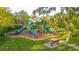 A view of a community playground with slides and climbing structures, providing a fun and safe recreation area at 1411 Ellis Fallon Loop, Oviedo, FL 32765