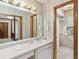 Bathroom with a long vanity, a large mirror, and a walk-in shower at 1432 Northridge Dr, Longwood, FL 32750