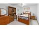 Comfortable bedroom with wooden furniture, dresser, and serene decor at 1432 Northridge Dr, Longwood, FL 32750