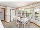 Dining area with a bay window, a chandelier, and decorative wallpaper at 1432 Northridge Dr, Longwood, FL 32750