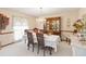 Elegant dining room with a chandelier, large window, and traditional furnishings at 1432 Northridge Dr, Longwood, FL 32750