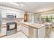 Well-lit kitchen with stainless steel appliances and a tile floor at 1432 Northridge Dr, Longwood, FL 32750