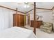 Main bedroom featuring a four-poster bed, and comfortable seating at 1432 Northridge Dr, Longwood, FL 32750