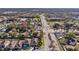 Extensive aerial view featuring a suburban neighborhood with a long busy street at 1493 Hyde Park Dr, Winter Park, FL 32792